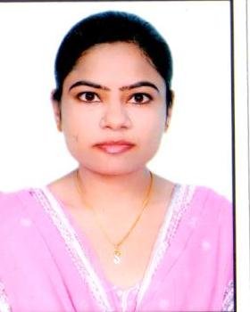 Portrait of Dr. Kapoor wearing traditional attire with academic books in background
